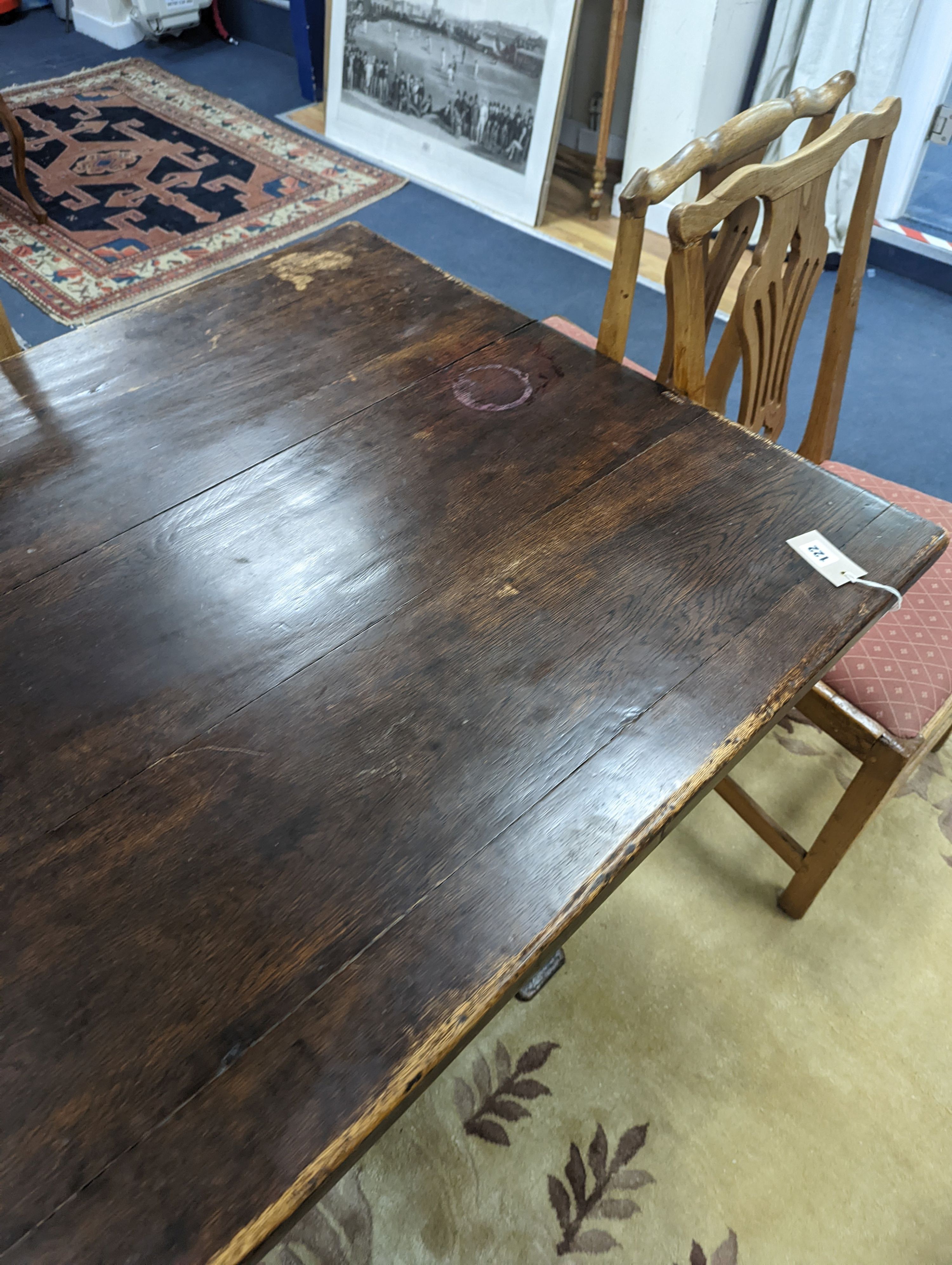 A 17th century style rectangular oak refectory dining table. Length -183cm, Width-91cm, Height-74cm.